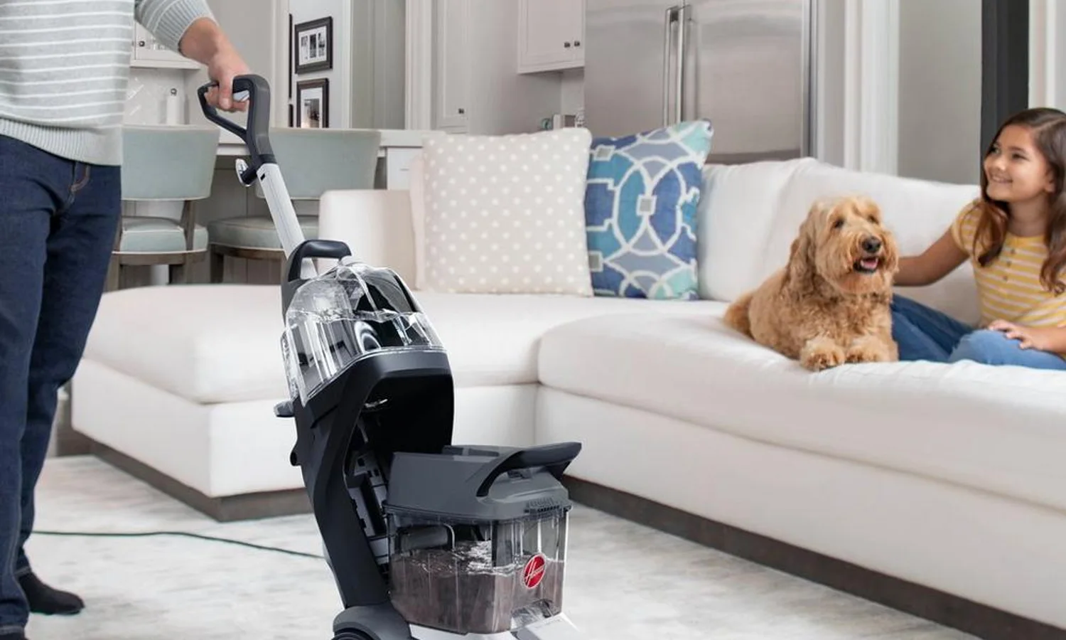 Hoover carpet cleaner washing a household carpet in a living room
