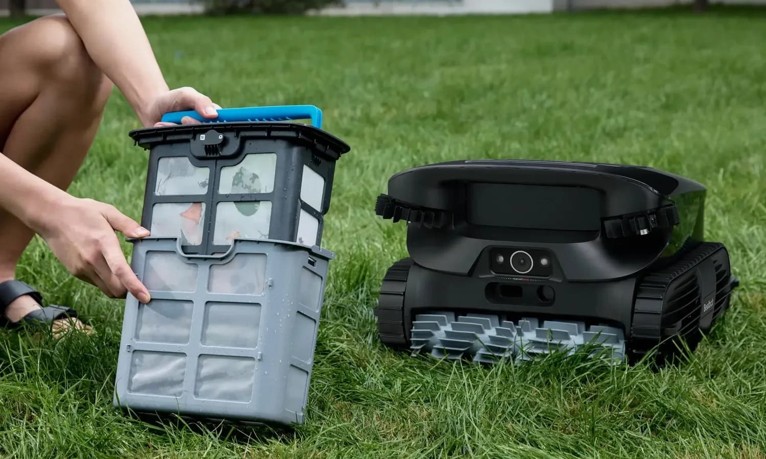 Beatbot AquaSense 2 Ultra robotic pool cleaner beside its removable filter baskets