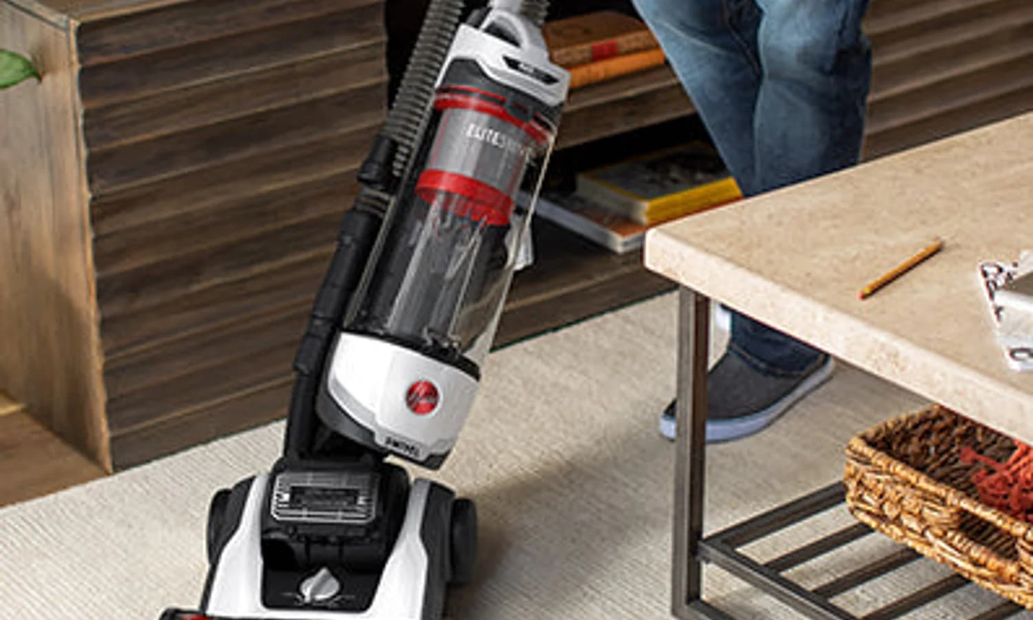 Hoover upright vacuum cleaning a household carpet