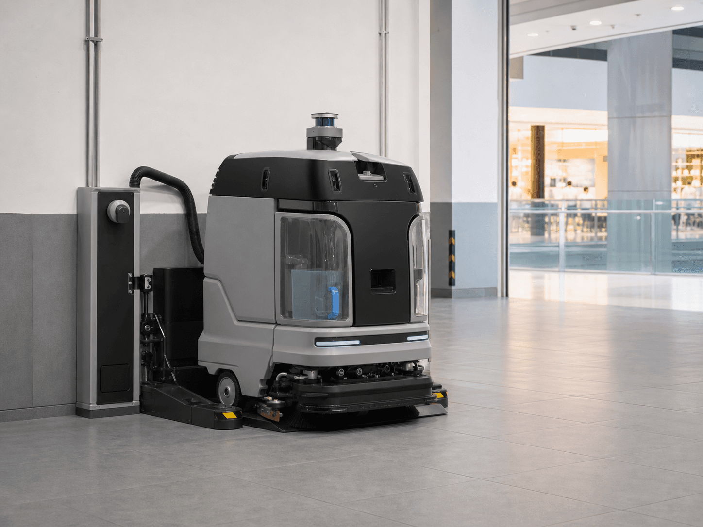 Illustrative commercial cleaning robot at a service station