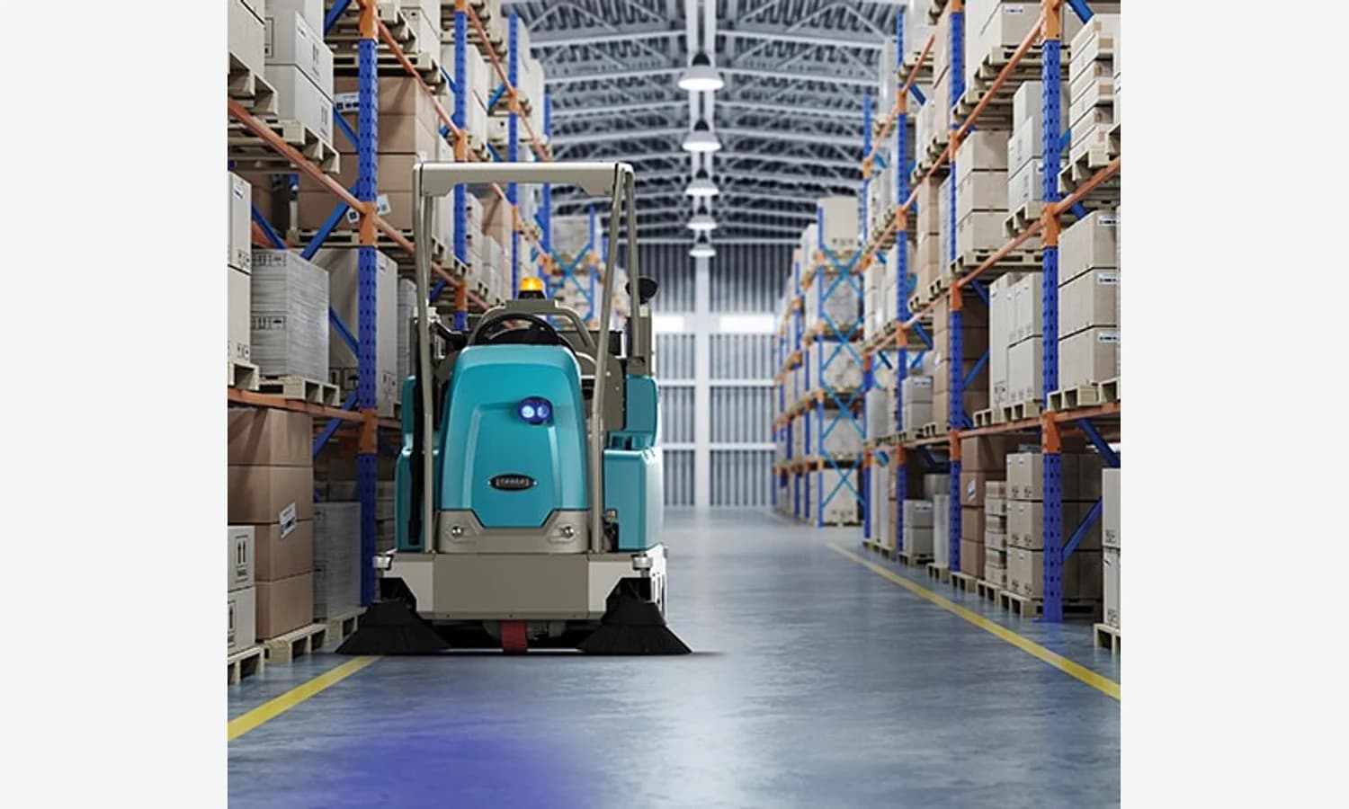 Tennant S16 ride-on sweeper operating in a warehouse