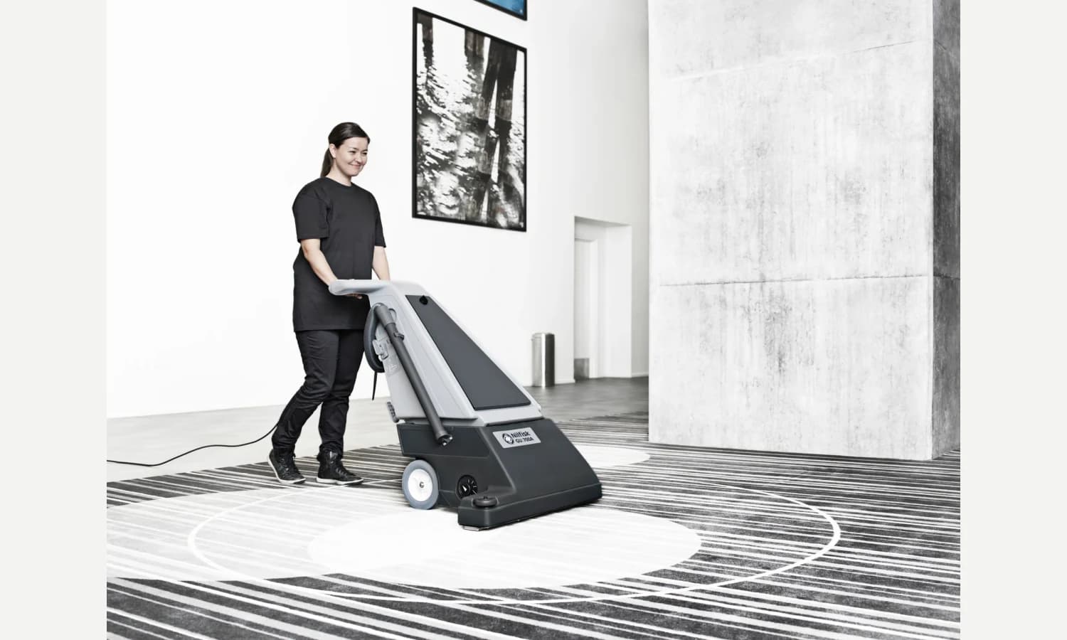 Nilfisk GU700A vacuum cleaning a meeting-room carpet