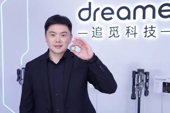 Dreame founder and CEO Yu Hao holding a product component