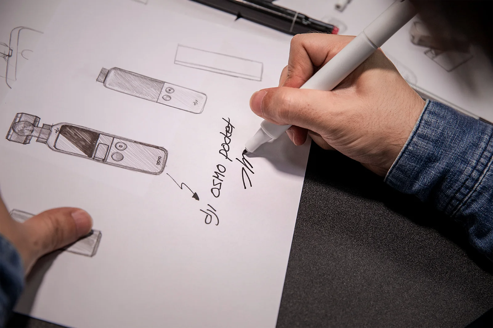 A designer sketches the original Osmo Pocket alongside other camera concepts.