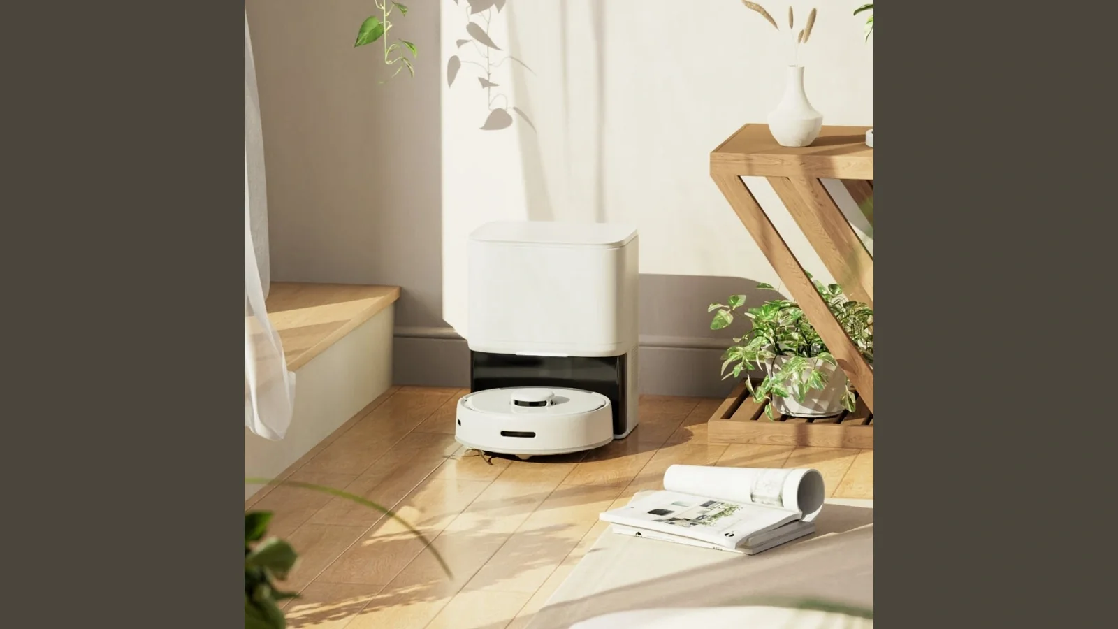 SwitchBot's original K10+ and dust-collection station placed beside furniture in an official household scene