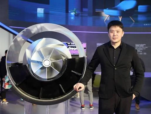 Dreame founder Yu Hao beside a high-speed digital motor display